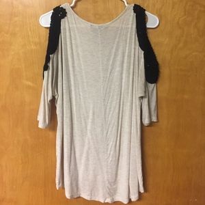 Tan shirt with black shoulder lace